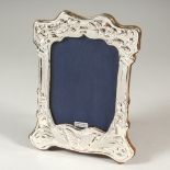 AN ART NOUVEAU STYLE SILVER PHOTOGRAPH FRAME. 21cms high.