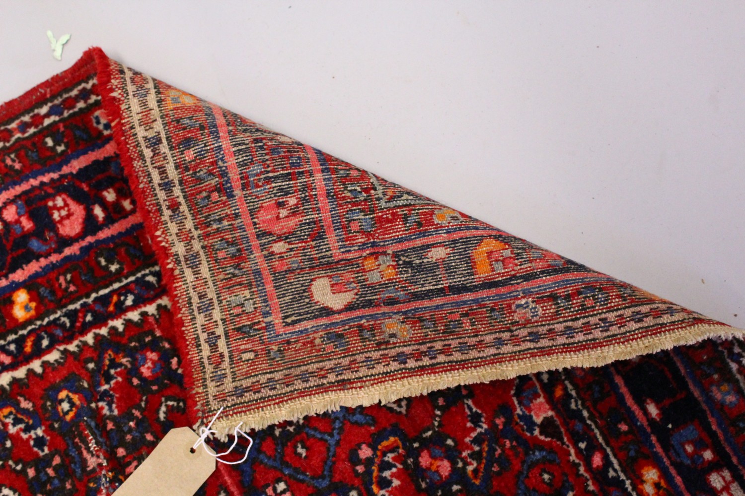 A PERSIAN RUG, red ground with central motif and similar border. 150cms x 105cms. - Image 6 of 7