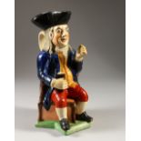 A RALPH WOOD TOBY JUG with a blue coat. 27cms high.