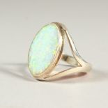 A SILVER AND OPAL RING.