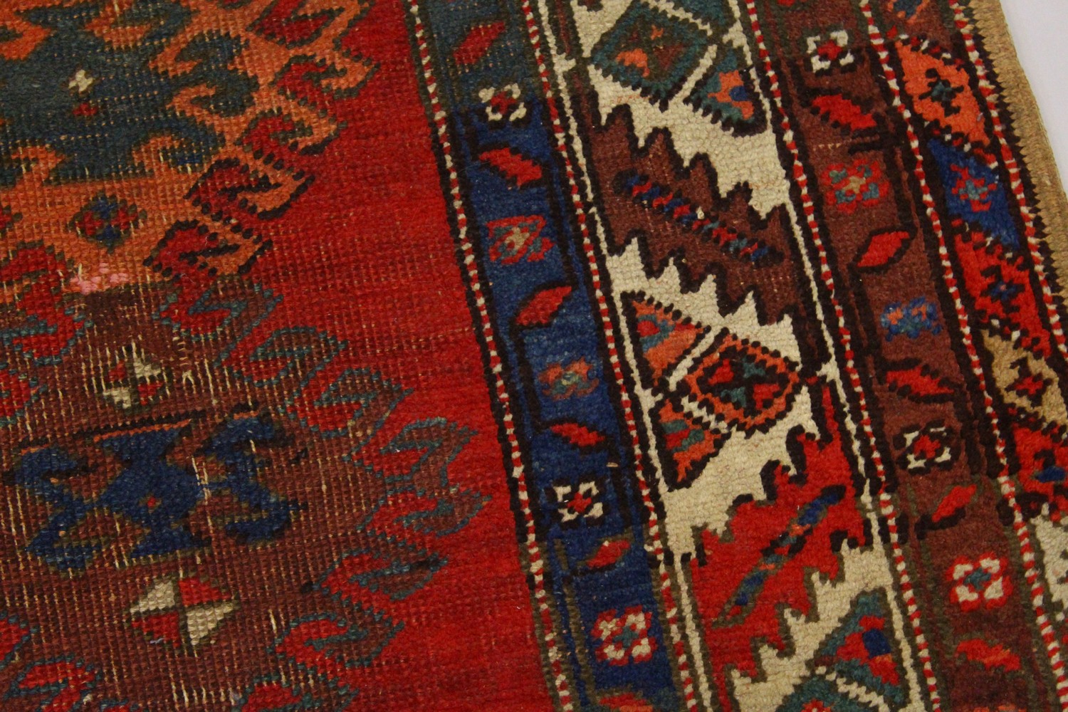 A PERSIAN RUG, red ground with six medallions, in a quadruple border. 200cms x 96cms. - Image 3 of 8