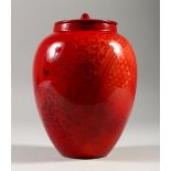 A BERNARD MOORE RED GINGER JAR AND COVER. 18cms high.