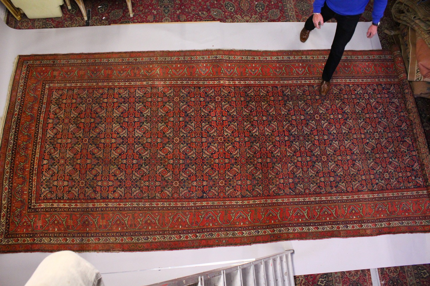 A PERSIAN LONG CARPET, blue ground with stylized geometric motifs, with a similar border. 500cms x - Image 2 of 11