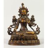 AN EASTERN BRONZE FIGURE OF A SEATED FEMALE DEITY, inset with hardstones. 22cms high.