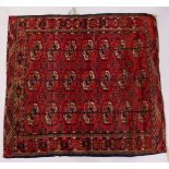 A SMALL TEKKE BOKHARA RUG, claret ground, three rows of seven gulls. 110cms x 100cms.