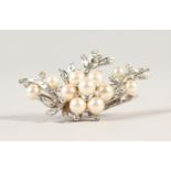 AN 18CT WHITE GOLD DIAMOND AND PEARL BROOCH.