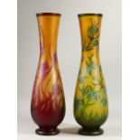 MUNZA - A LARGE PAIR OF CAMEO GLASS VASES with flowers in relief. 55cms high.
