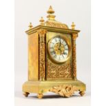 A GOOD 19TH CENTURY FRENCH GILT METAL CLOCK "RACK" No. 9971 with column supports. 31cms high.