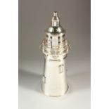 A NOVELTY COCKTAIL SHAKER IN THE FORM OF A LIGHTHOUSE. 35cms high.