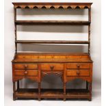 A 19TH CENTURY OAK WELSH DRESSER, with a double Delft rack, the base with five small dummy