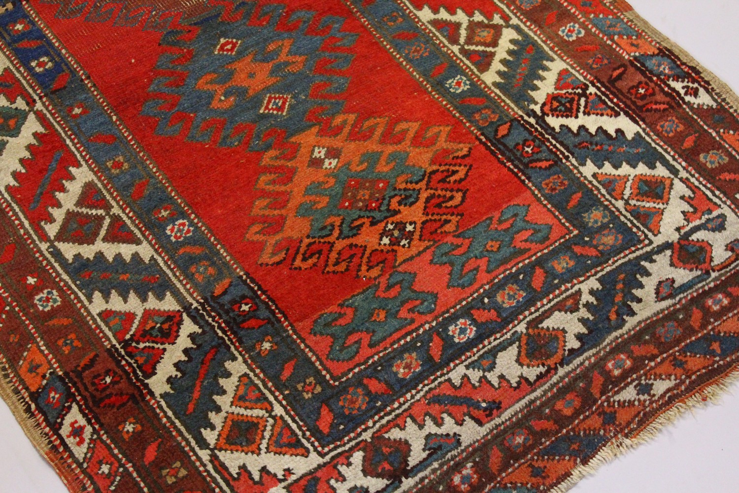 A PERSIAN RUG, red ground with six medallions, in a quadruple border. 200cms x 96cms. - Image 2 of 8