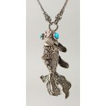 A SILVER AND MARCASITE FISH PENDANT AND CHAIN.
