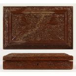 A FINELY CARVED INDIAN SANDALWOOD BOX with velvet interior. 28cms long x 17cms wide.