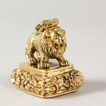 A 9CT GOLD PLATED LION SEAL.