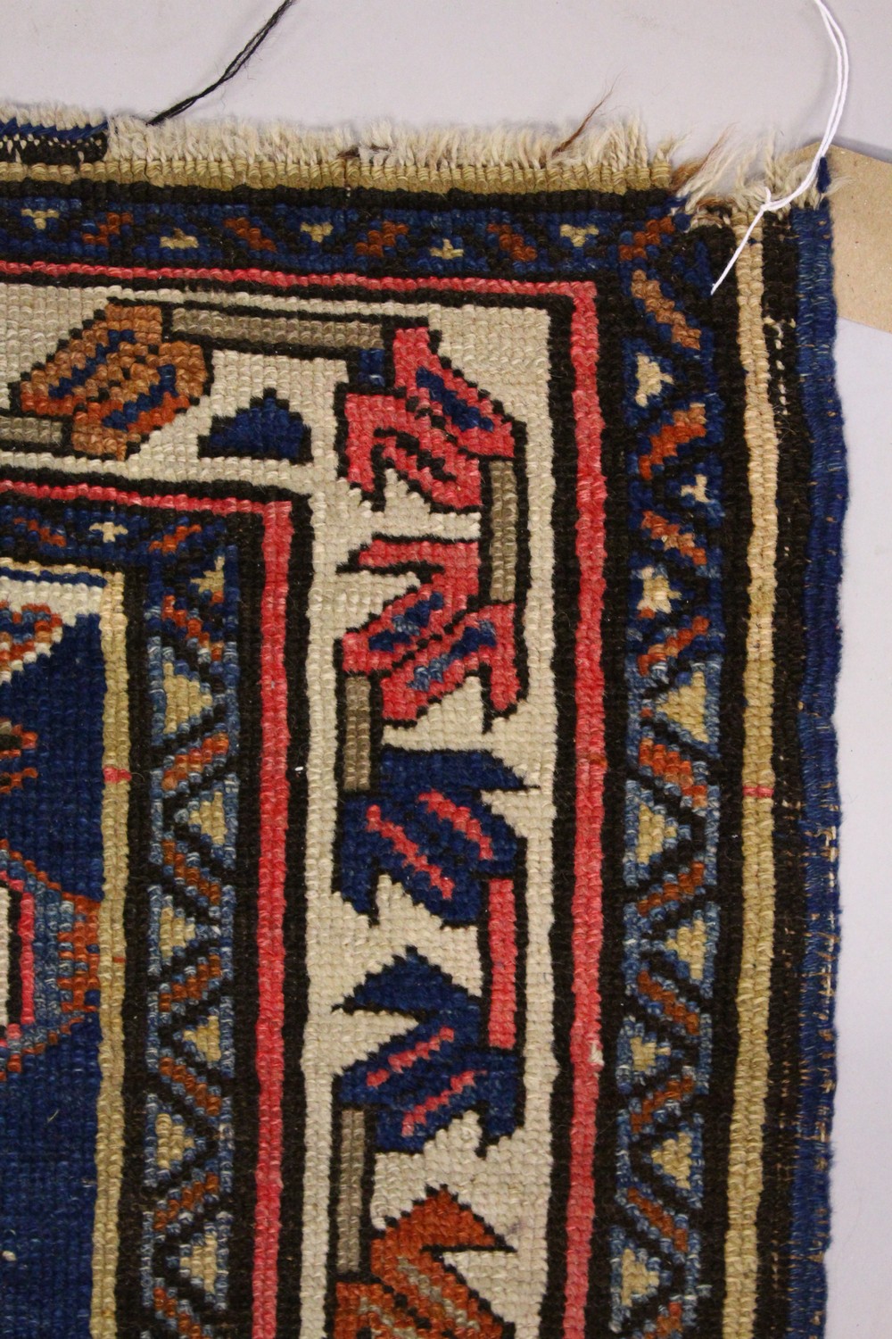 A PERSIAN RUG, blue ground with stylized motifs in a conforming border. 218cms x 130cms. - Image 2 of 9