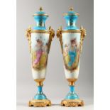 A GOOD PAIR OF SEVRES STYLE TAPERING PORCELAIN VASES, painted with reverse panels of classical