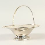A VICTORIAN OVAL SWEETMEAT BASKET with swing handle. London 1892.