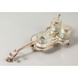 A CELLO PLATED THREE BOTTLE CRUET. 23cms long.