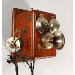 AN EARLY WALL HANGING TELEPHONE with two bells, mouth piece and handle. 22cms long x 13cms wide x