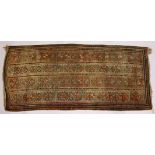 AN UNUSUAL PERSIAN RUG, beige ground with four rows of twenty motifs. 280cms x 122cms.