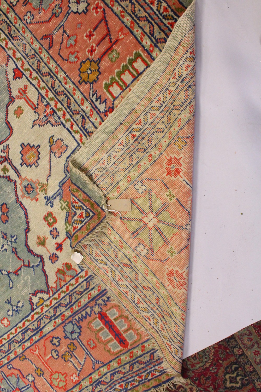 A LARGE HERIZ CARPET, pale blue ground, salmon pink central motif in a confirming border (worn). 4. - Image 9 of 10