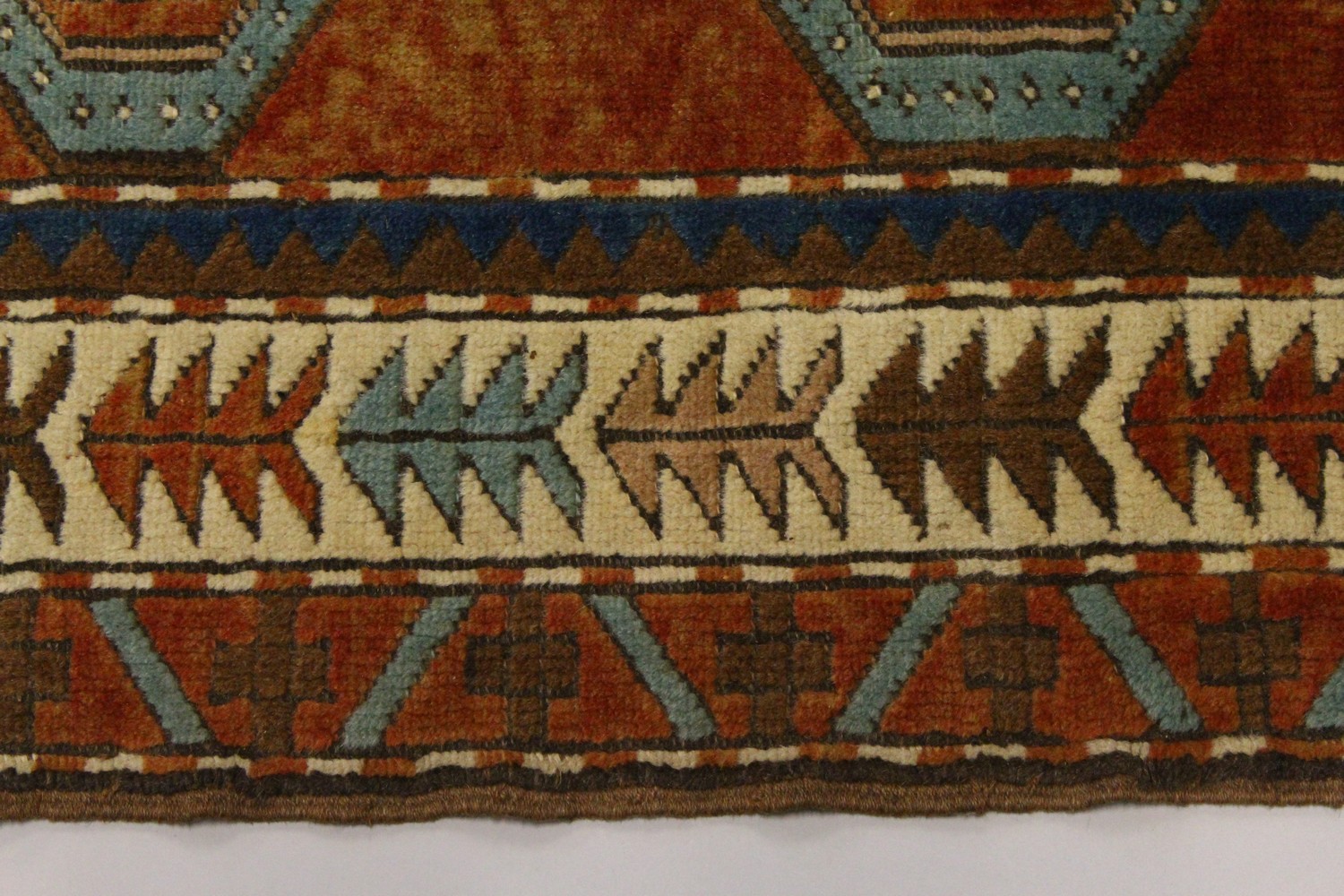 A SMALL PERSIAN RUG, the centre with two large geometric motifs, in a border with stylised tree - Image 2 of 8