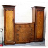 A 19TH CENTURY MAHOANY DROP CENTRE WARDROBE, with a central serpentine chest of two short and
