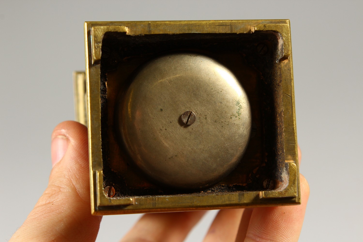 A MINIATURE BRASS CARRIAGE CLOCK, with alarm and subsidiary dial. 12cms high. - Image 6 of 7