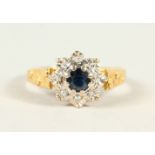AN 18CT GOLD, DIAMOND AND SAPPHIRE DRESS RING.