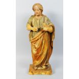 AN 18TH CENTURY ITALIAN CARVED WOOD STANDING SAINT. 21ins high.