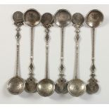 SIX CHINESE SILVER COIN MOUNTED SPOONS. 17.5cms long.