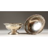 A PAIR OF CIRCULAR PIERCED SILVER TAZZAS. London 1928. 13cms diameter.