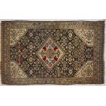 A GOOD SMALL PERSIAN RUG, dark blue ground with allover floral decoration. 185cms x 110cms.