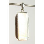 A SILVER AND MOTHER-OF-PEARL PENDANT.