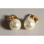 A PAIR OF GOLD AND PEARL EAR STUDS.