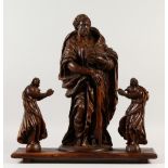 A RARE 17TH CENTURY ITALIAN CARVED FRUITWOOD APOSTLE, 52cms high, with a pair of angels 29cms high