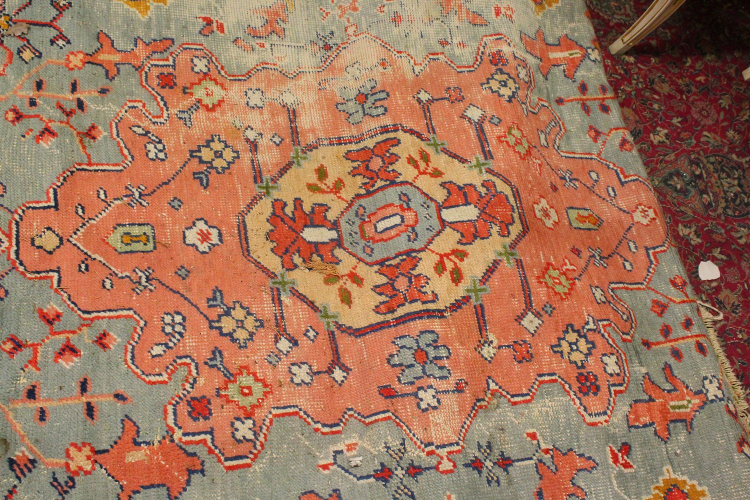 A LARGE HERIZ CARPET, pale blue ground, salmon pink central motif in a confirming border (worn). 4. - Image 8 of 10
