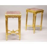A PAIR OF GILTWOOD AND ROUGE MARBLE SQUARE SHAPED STANDS. 41cms wide x 73cms high.
