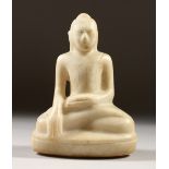AN EARLY CARVED MARBLE SEATED BUDDHA. 17cms high.