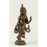 AN EASTERN BRONZE FIGURE of a standing female deity. 26cms high.