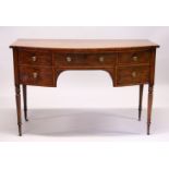 AN EARLY 19TH CENTURY MAHOGANY BOWFRONT SIDEBOARD, the central drwer flanked by a deep drawer and