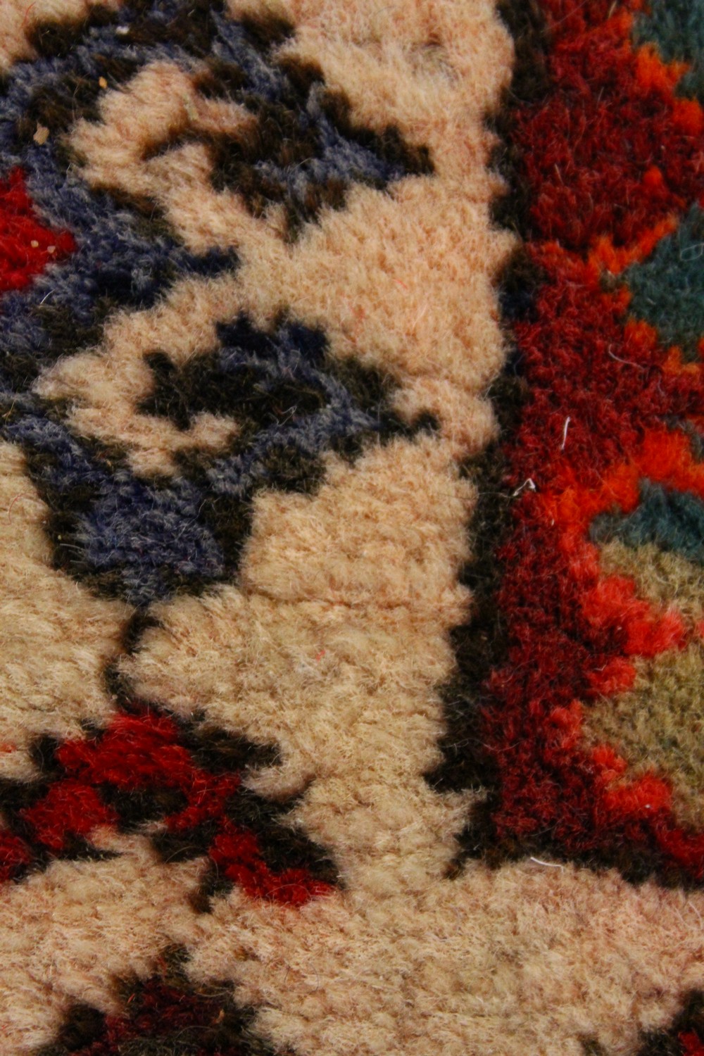 A PERSIAN LONG CARPET / RUNNER, bright red ground with three blue ground motifs in a stylized - Image 6 of 8