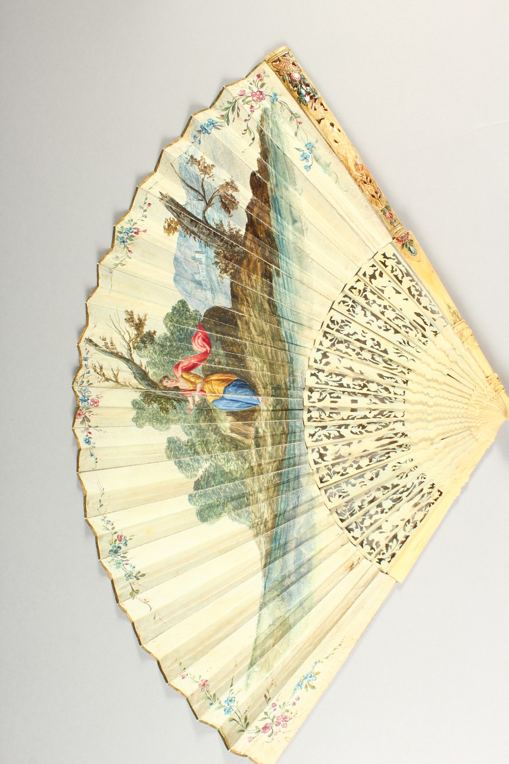 A LOUIS XVTH CARVED AND PAINTED IVORY FAN painted with classical scenes. Provenance: J. DUVELLEROY - Image 3 of 7
