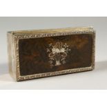 A SMALL SILVER AND TORTOISESHELL BOX, London 1910. 9cms long.