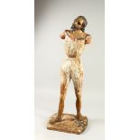 A 17TH CENTURY ITALIAN CARVED AND GILDED STANDING FIGURE OF A MAN (arms missing). 88cms high.