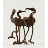 A SMALL JAPANESE BRONZE MODEL OF THREE BIRDS. 5.5cms high..