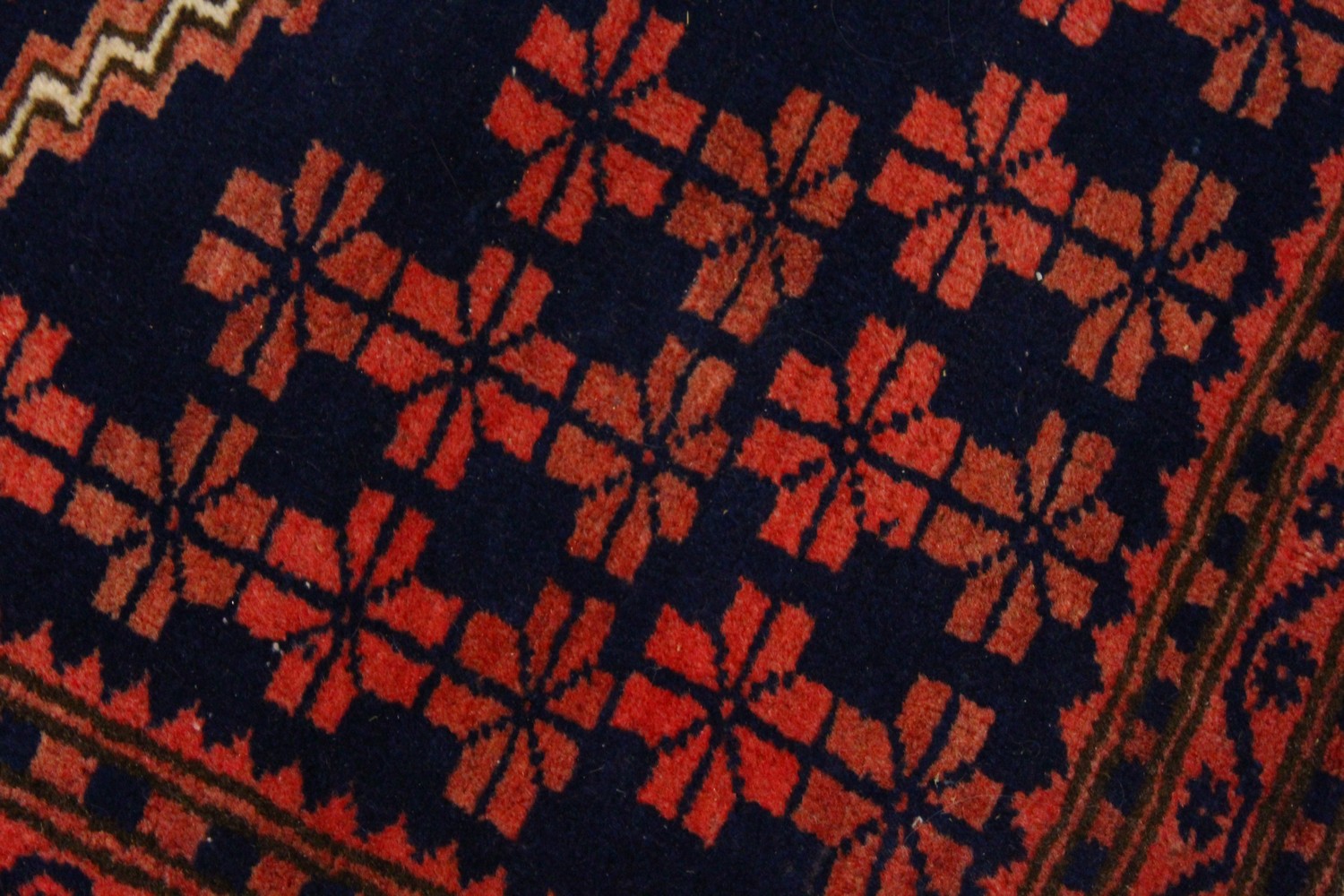 A PERSIAN RUG, dark blue ground, geometric motifs in a multiple border. 195cms x 110cms. - Image 3 of 8