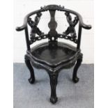 A LATE 19TH / EARLY 20TH CENTURY CHINESE HARD WOOD CARVED HOOP BACK ARM CHAIR, carved and pierced