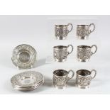 A SET OF SIX SOLID SILVER PERSIAN TEA GLASS HOLDERS AND SAUCERS.