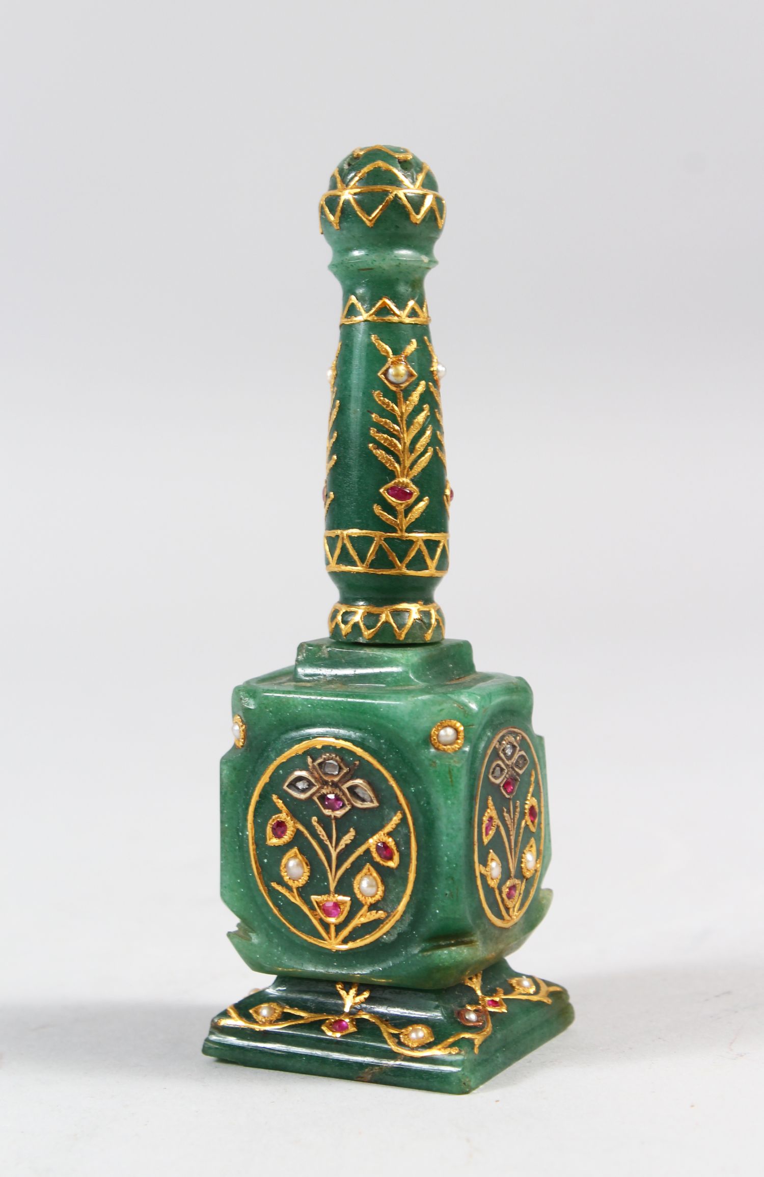 A SMALL LATE 19TH-EARLY 20TH CENTURY INDIAN JEWEL SET GOLD INLAID JADE PERFUME BOTTLE, 42cm high.